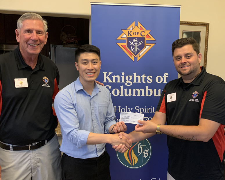 Presentation of donation check to Seminarian Tuan Nguyen